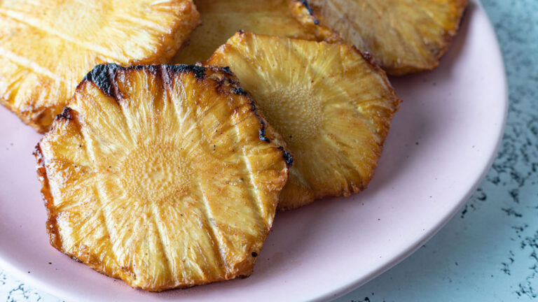 Smoked pineapples on a plate.