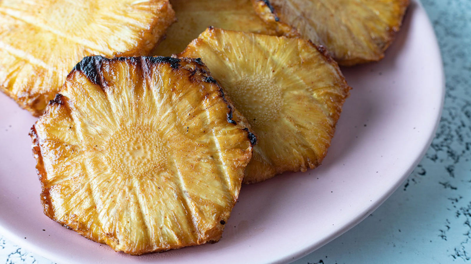Smoked pineapples on a plate.