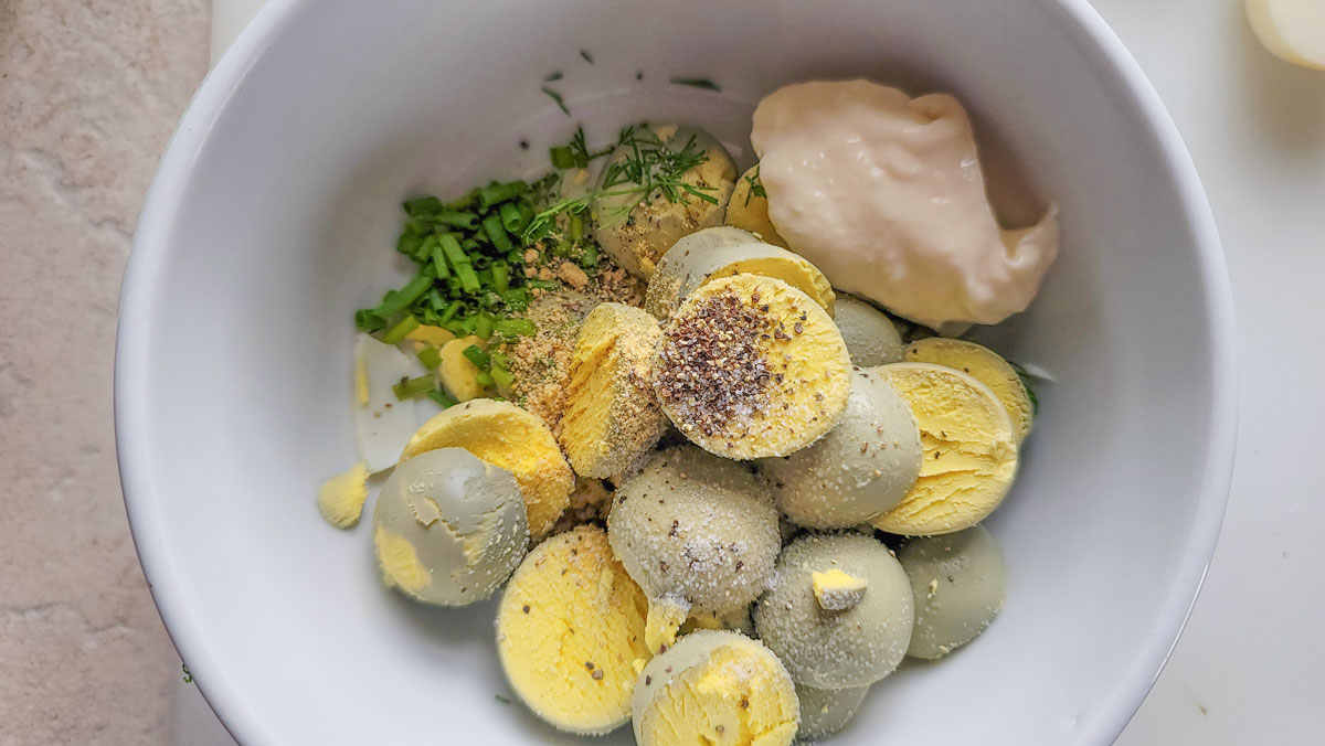 Egg yolks in a bowl with the rest of the ingredients.