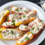 Mini bell peppers stuffed with smoked salmon dip.