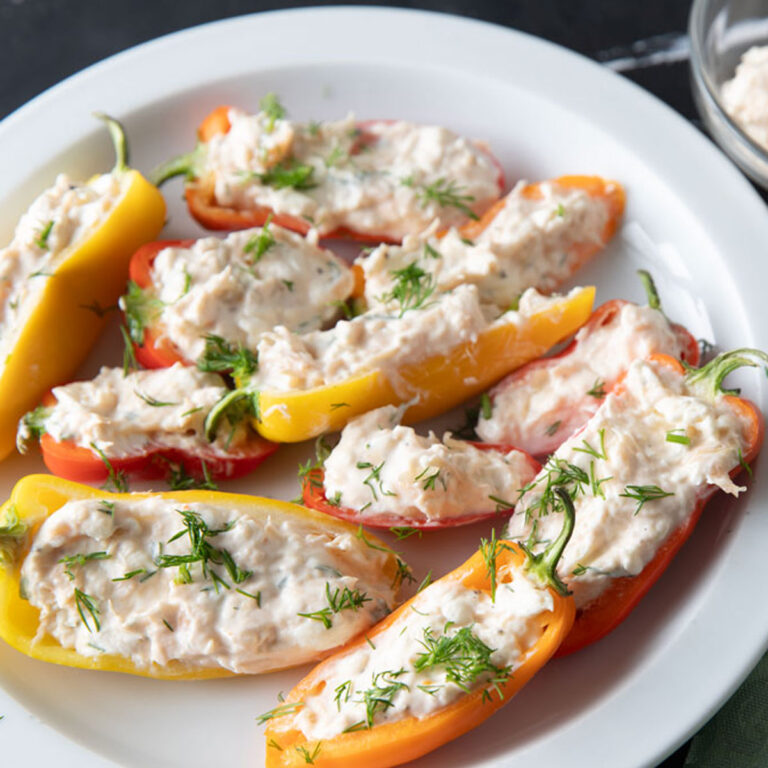Mini bell peppers stuffed with smoked salmon dip.