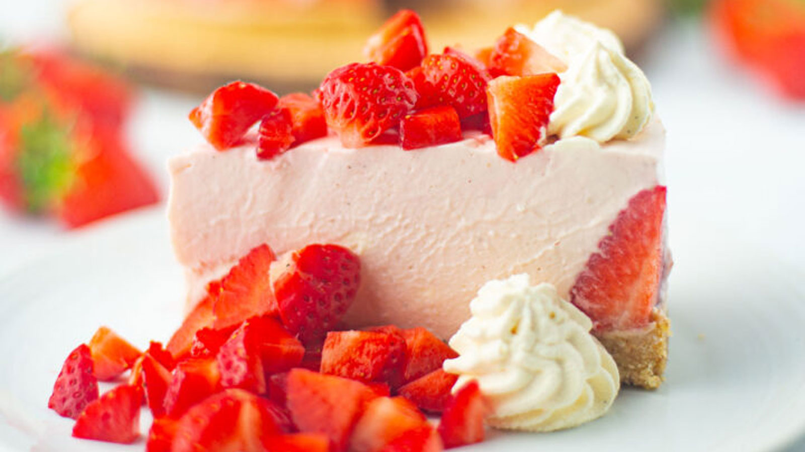 A slice of strawberry cheesecake.