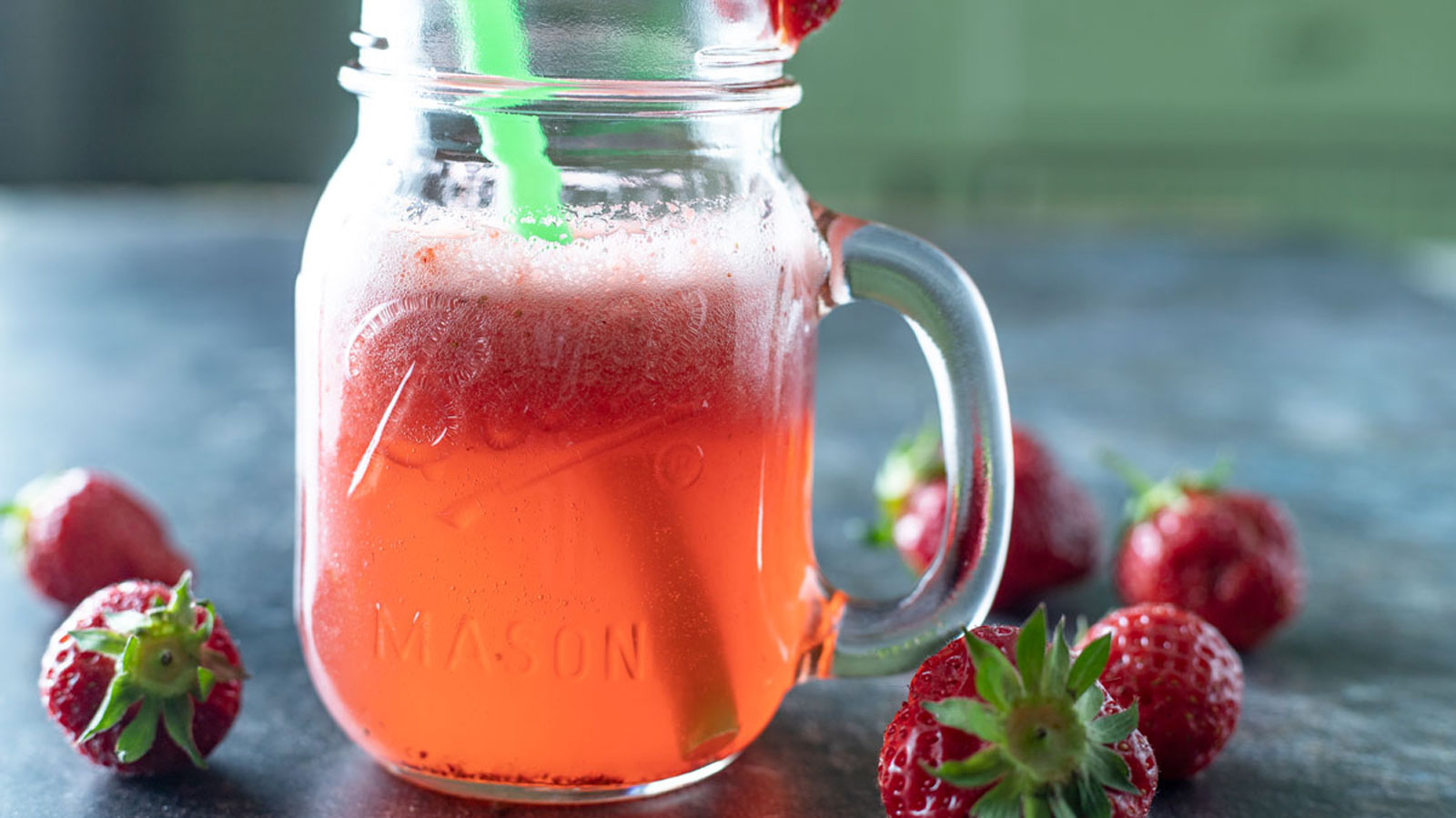 Strawberry juice in a mason jar.