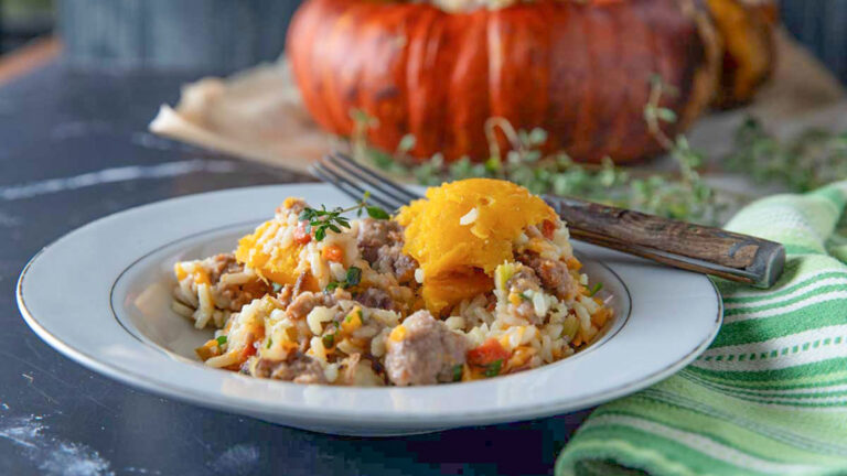 Stuffed turban squash filling in a white bowl.