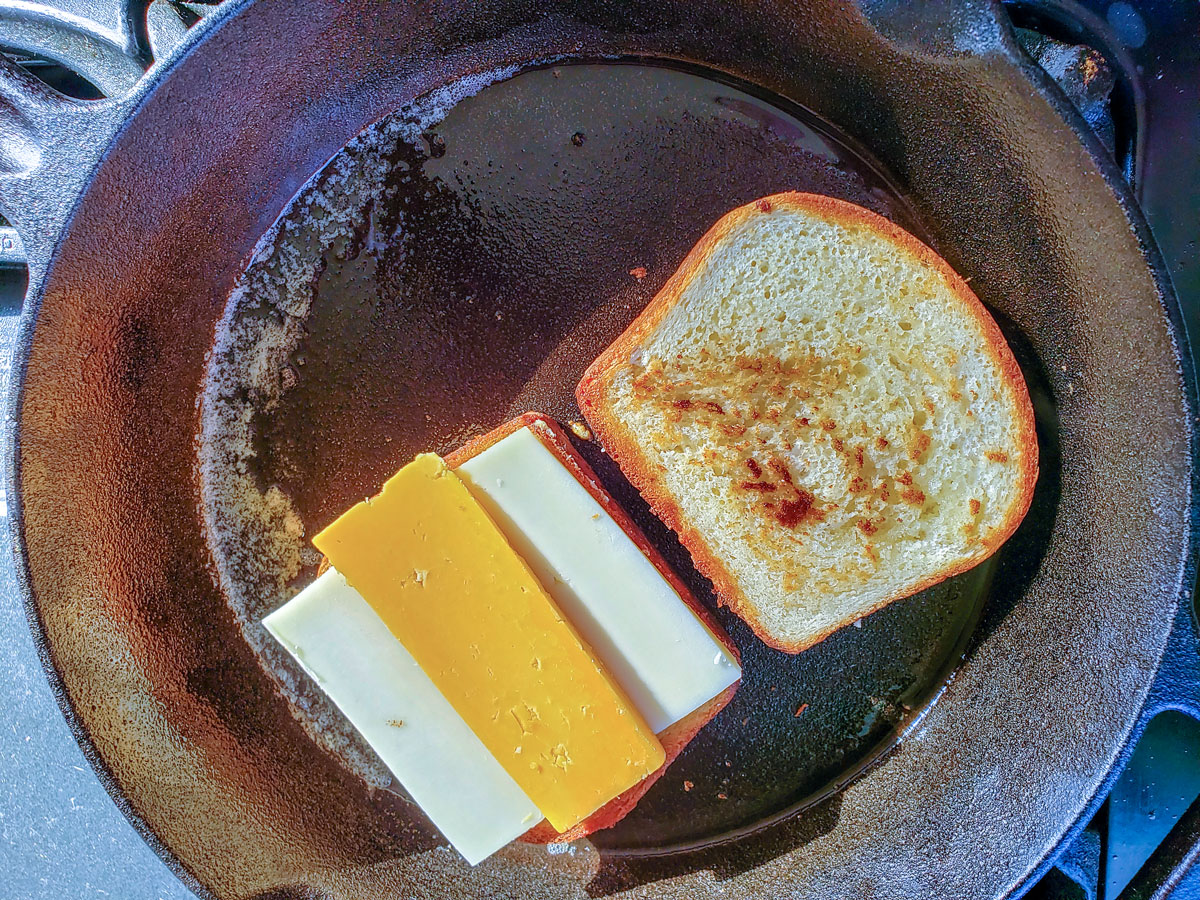 One of the browned bread topped with cheese.