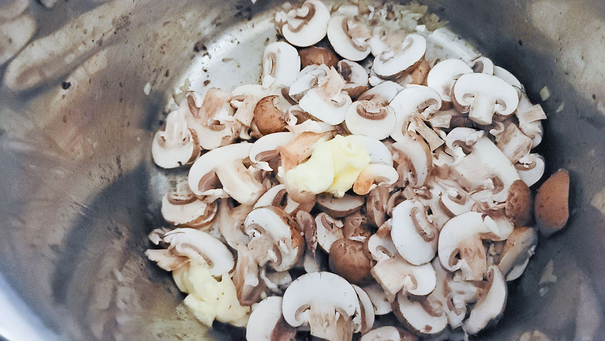 Mushrooms in the pan with more butter.