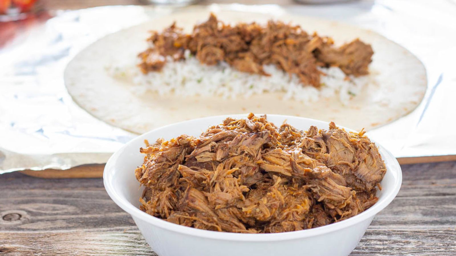 White bowl of barbacoa beef.