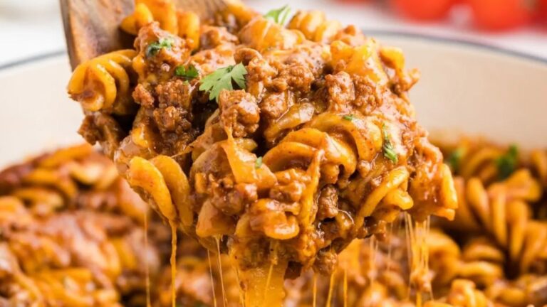 Beef enchilada pasta with pulled cheese.