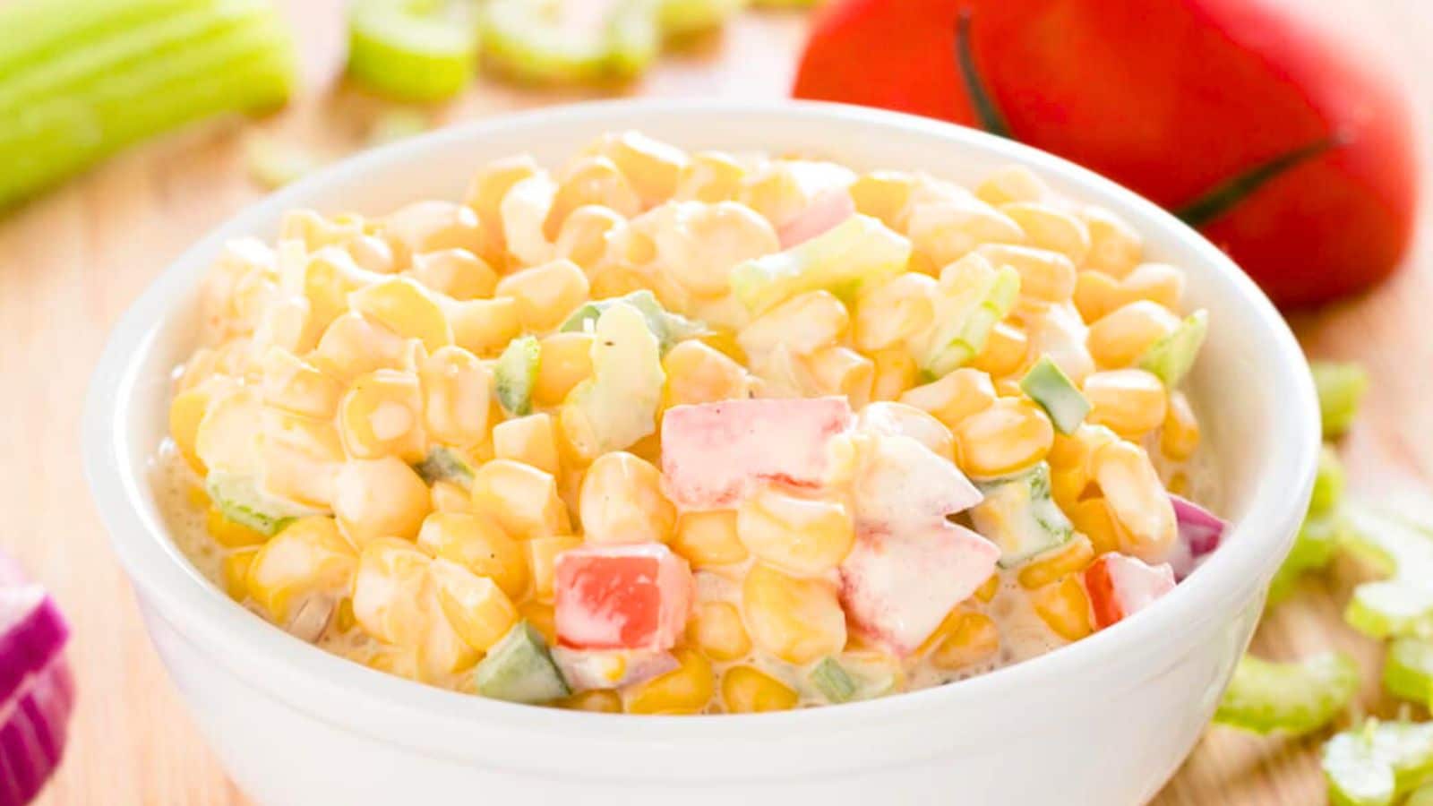 White bowl of corn salad.
