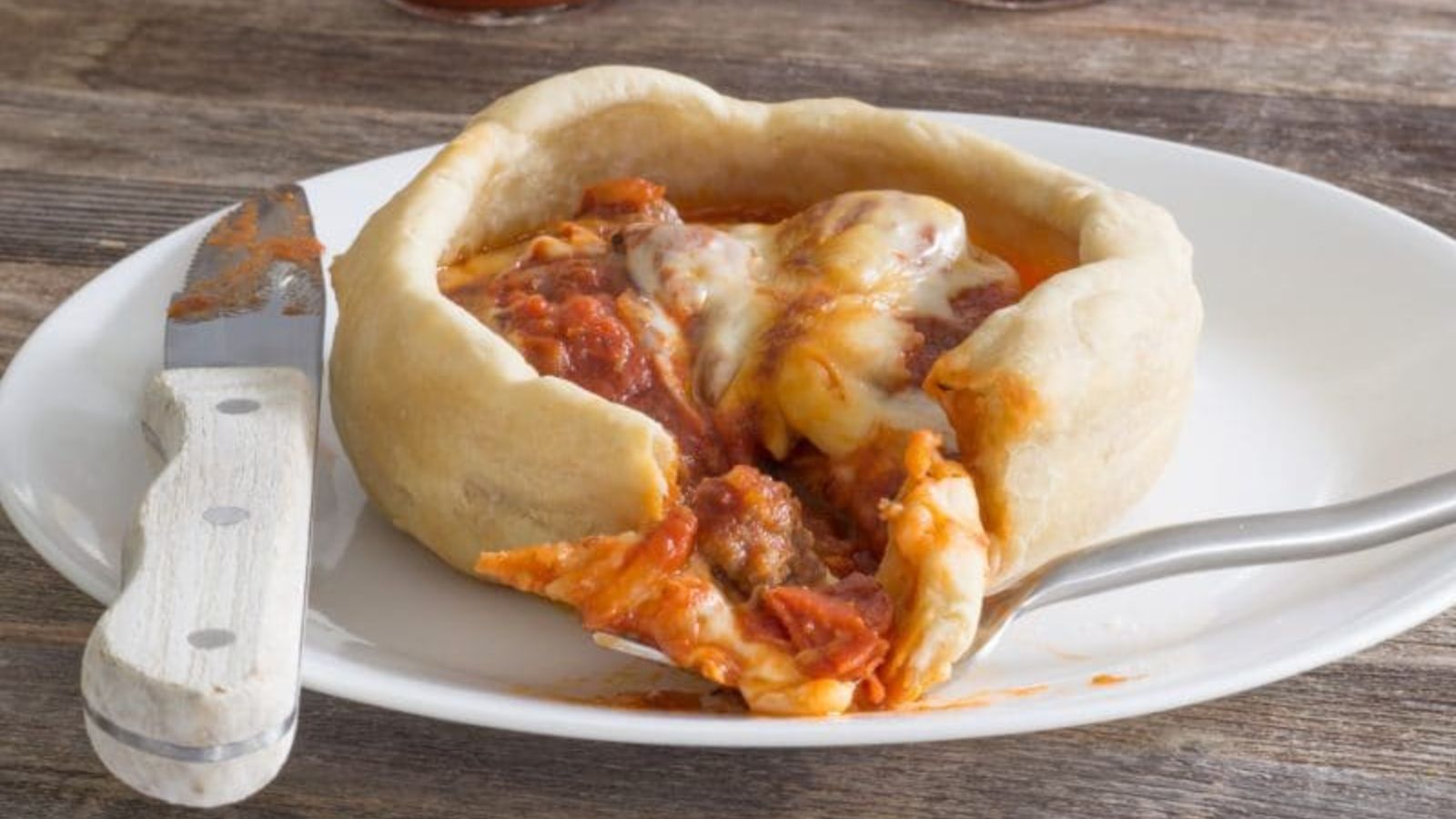 Pizza pot pie on a plate.