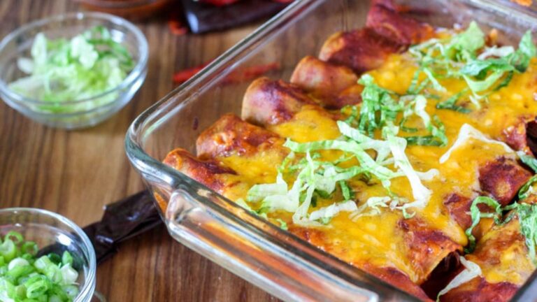 Venison enchilada on a glass tray.