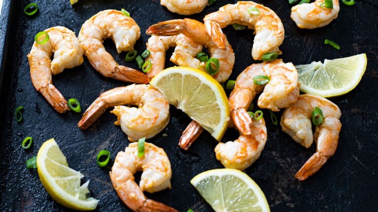 Air-fried shrimp on a black tray.