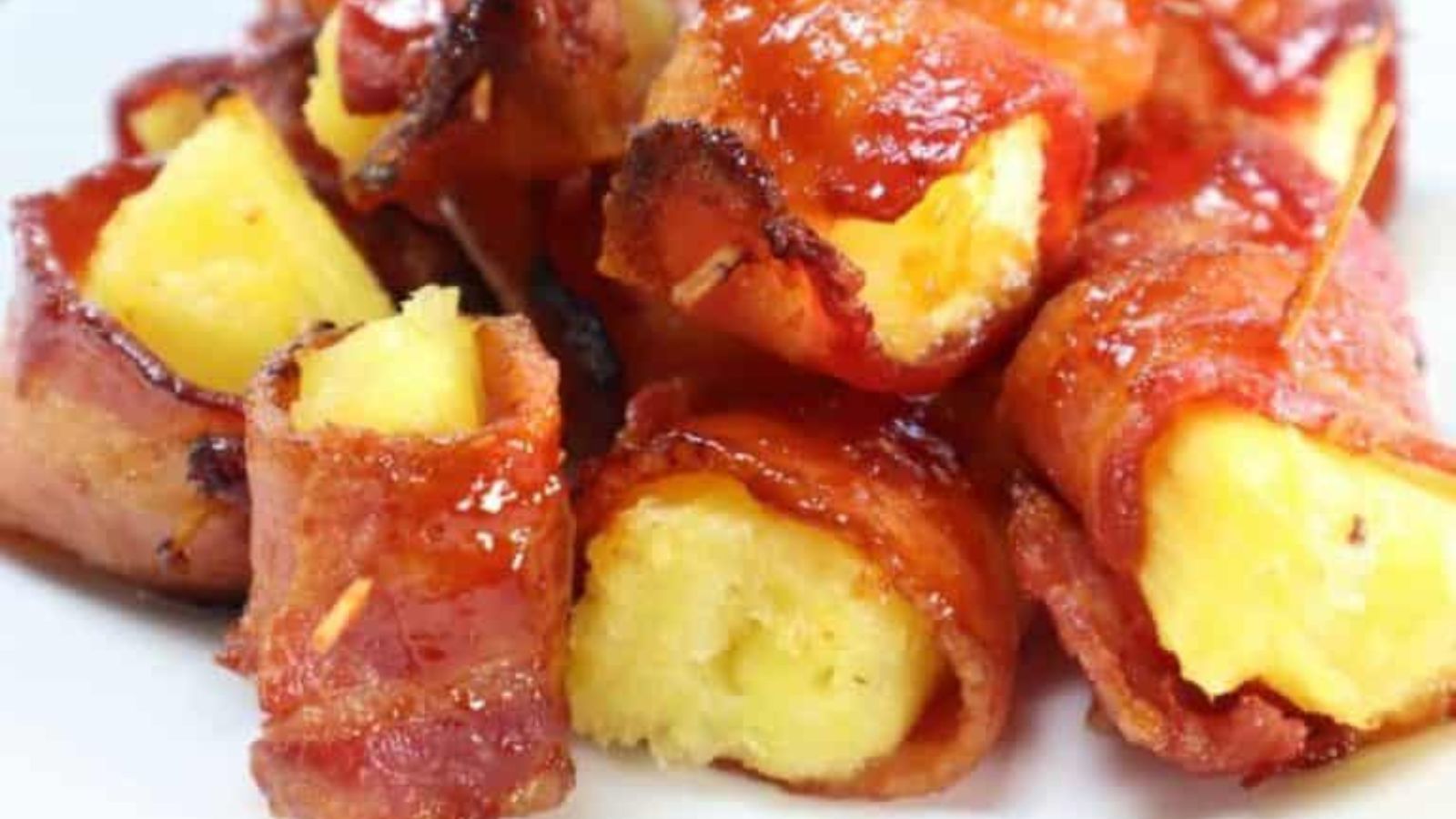 Pineapple chunks wrapped in crispy bacon.