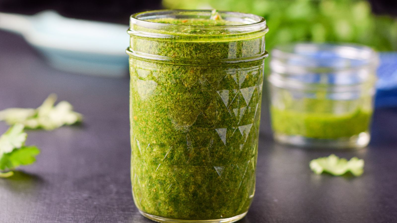 Green chimichurri sauce in a half-pint jar.