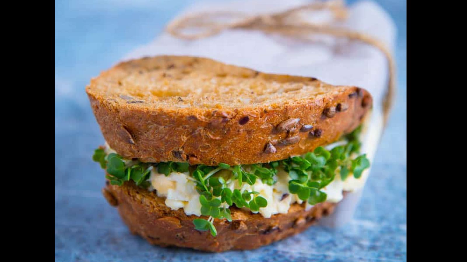 Egg sandwich with fresh cress on wheat bread.