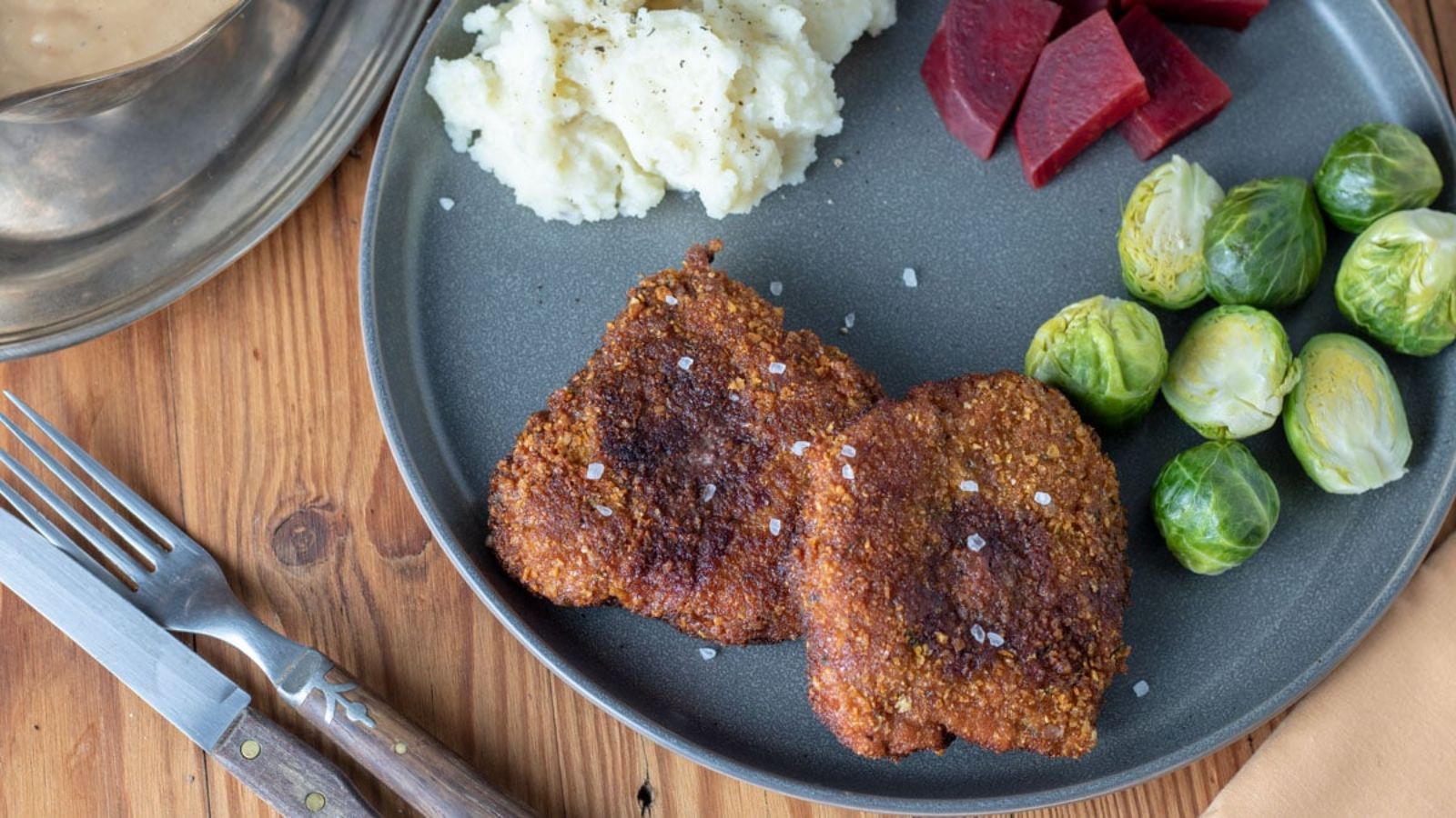 Chicken fried venison on a plate.