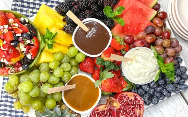 Various fruits and dips on a platter.