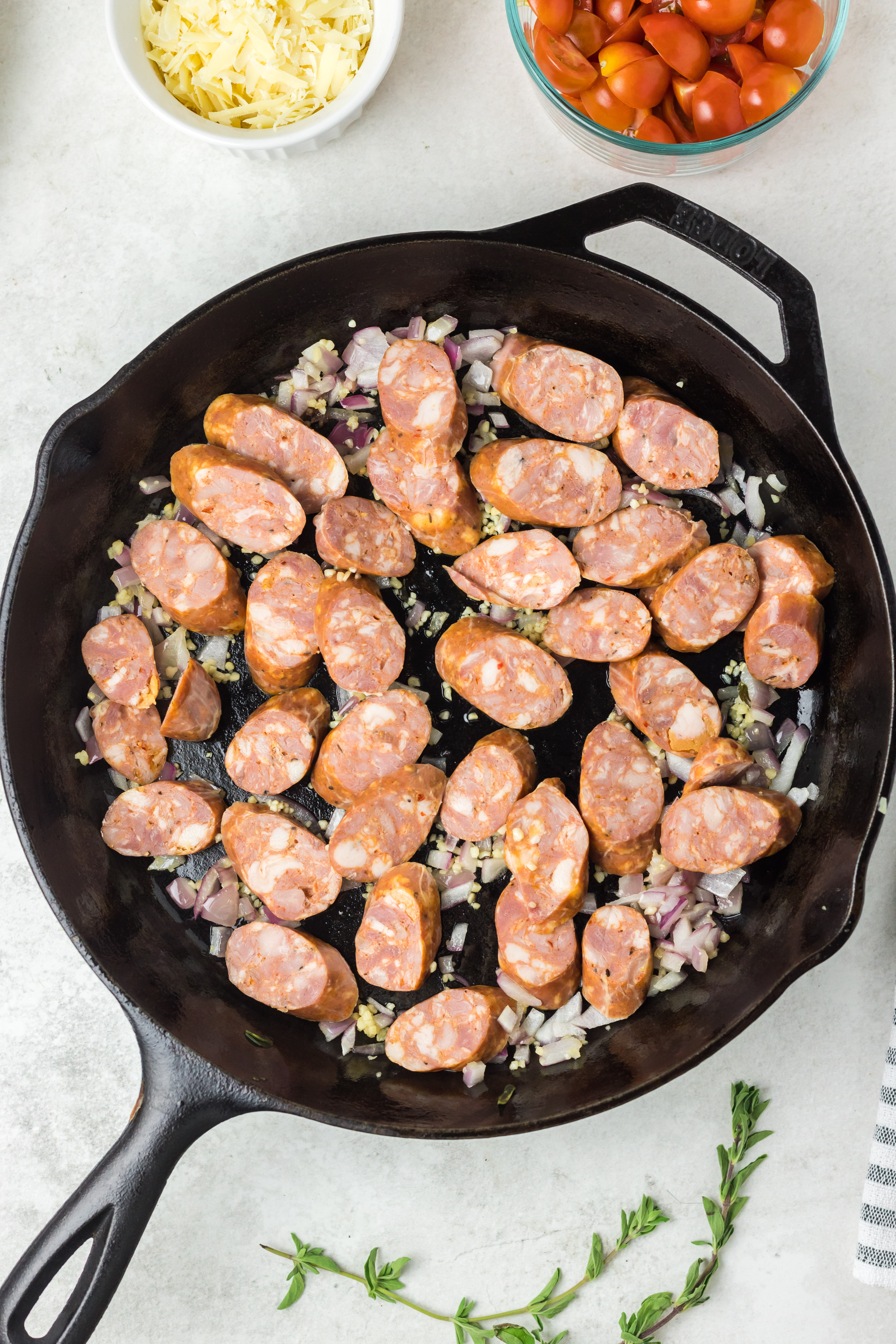 Chorizo added to the skillet with the onions.