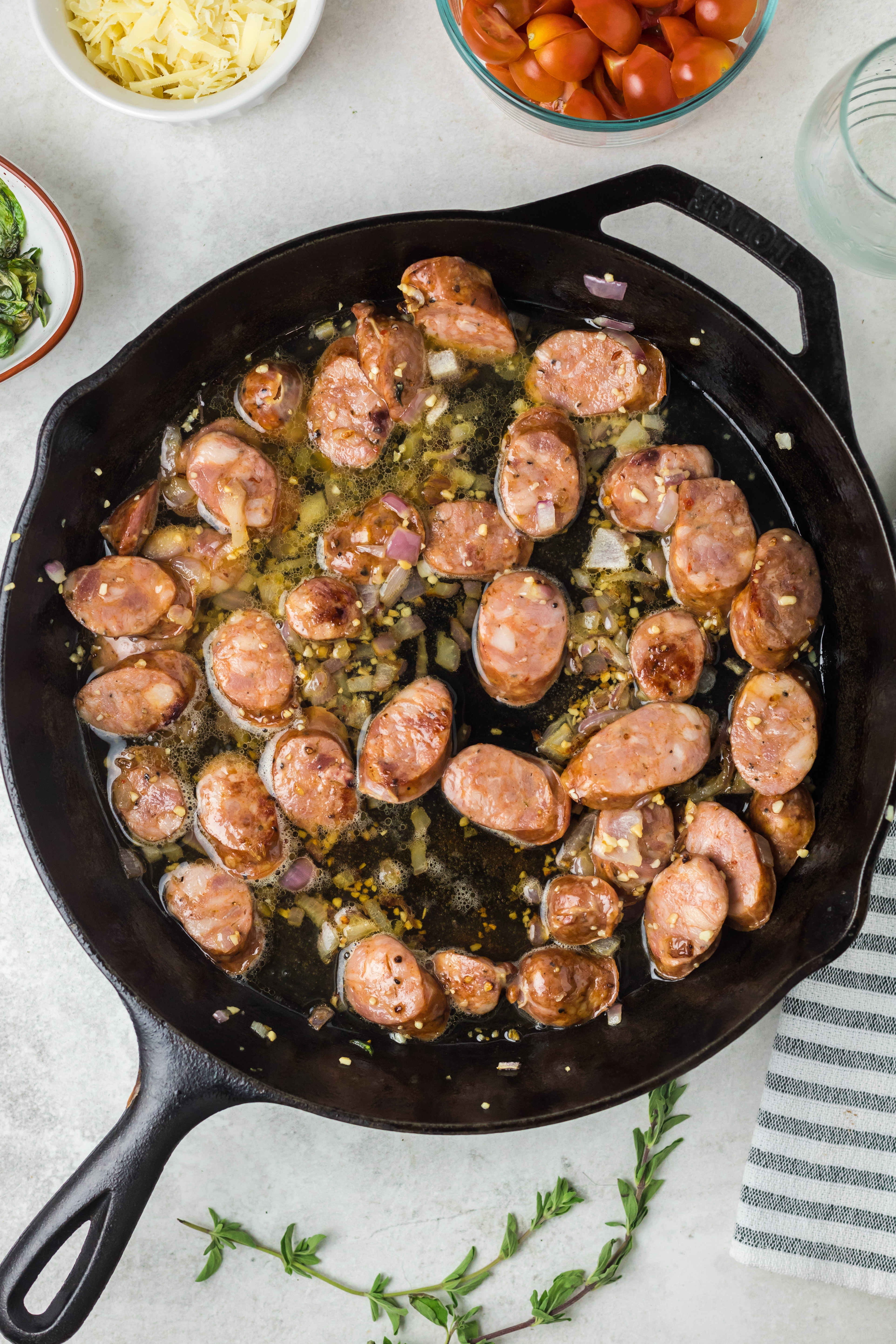 Browned sausage in the skillet.