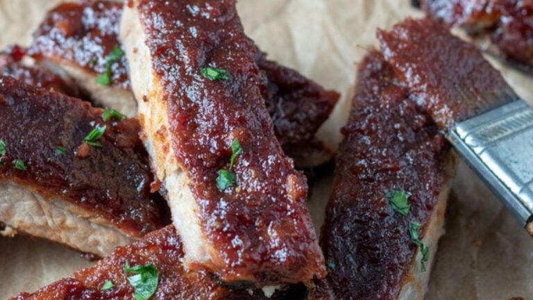 Close up of saucy smoked ribs.