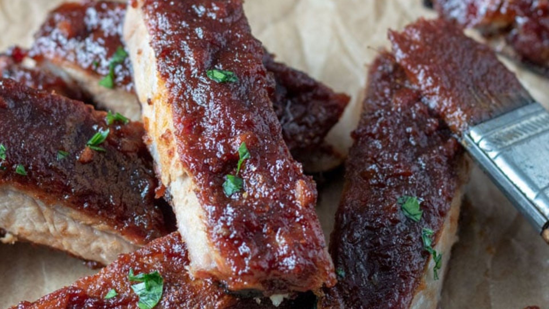 Close up of saucy smoked ribs.