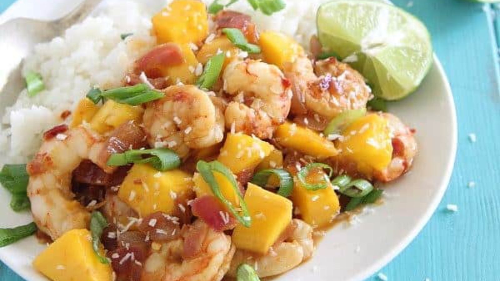 Mango with shrimp on a plate.