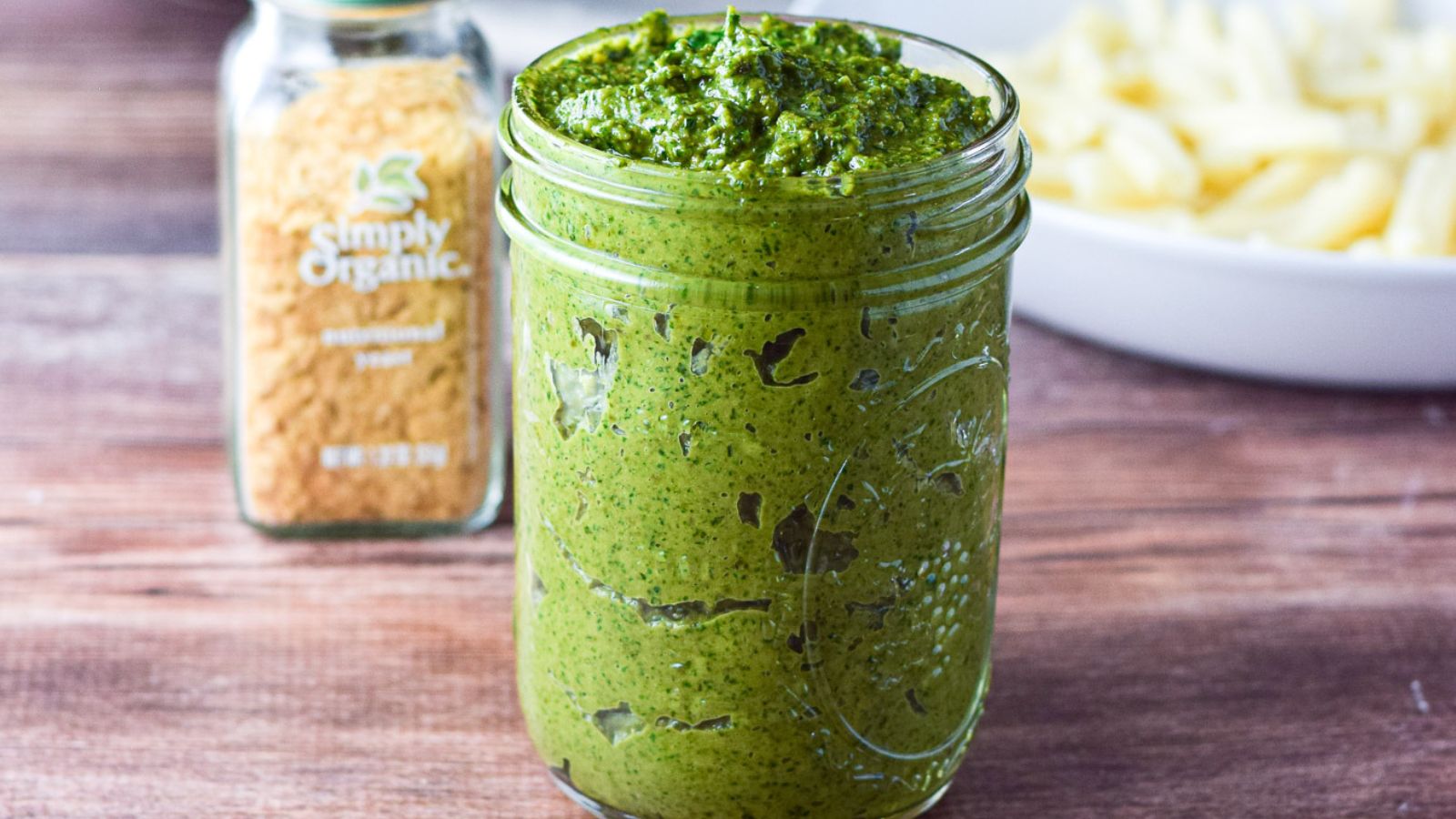 Half-pint jar filled with pesto.