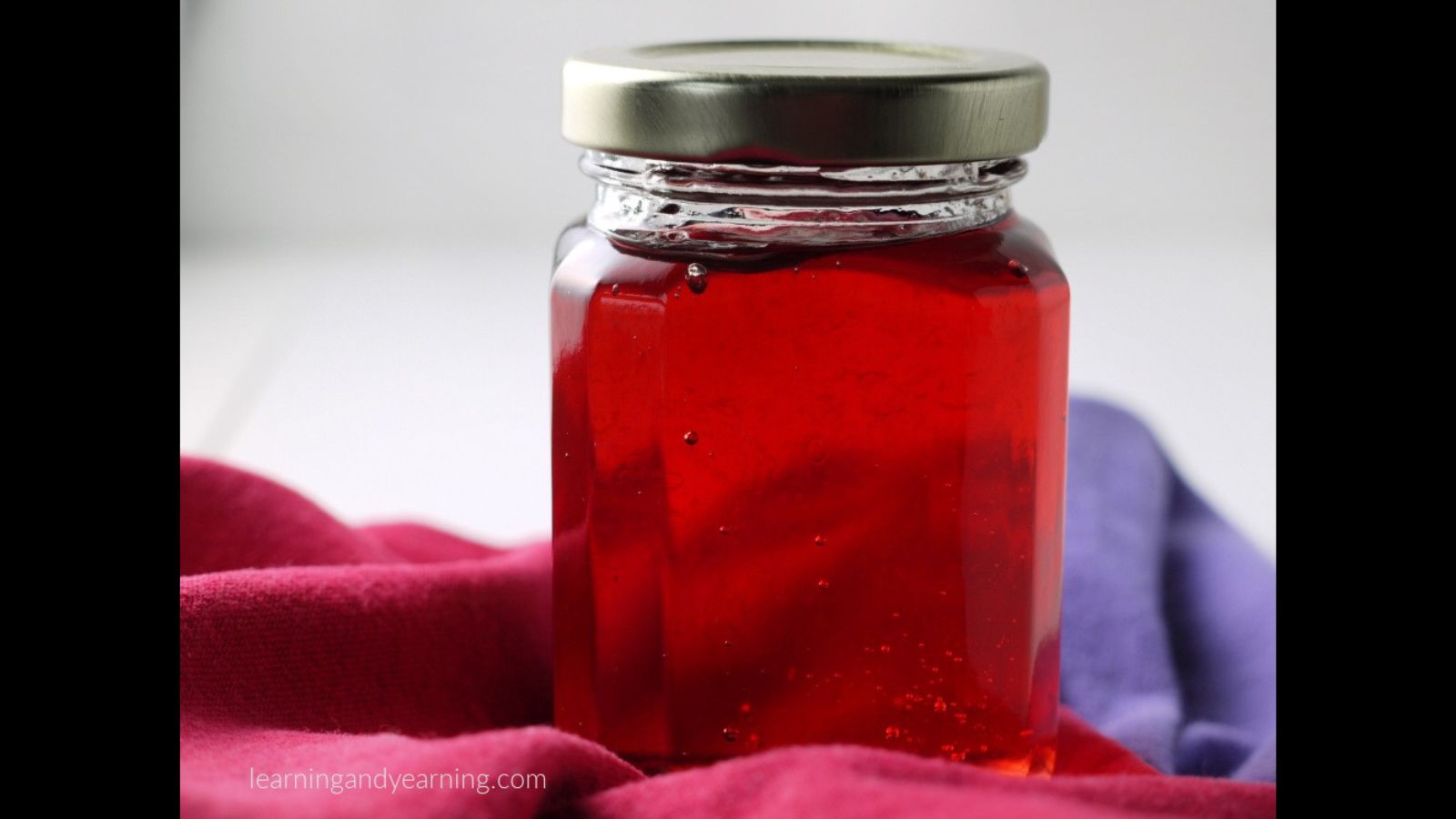 Jar of violet jelly.