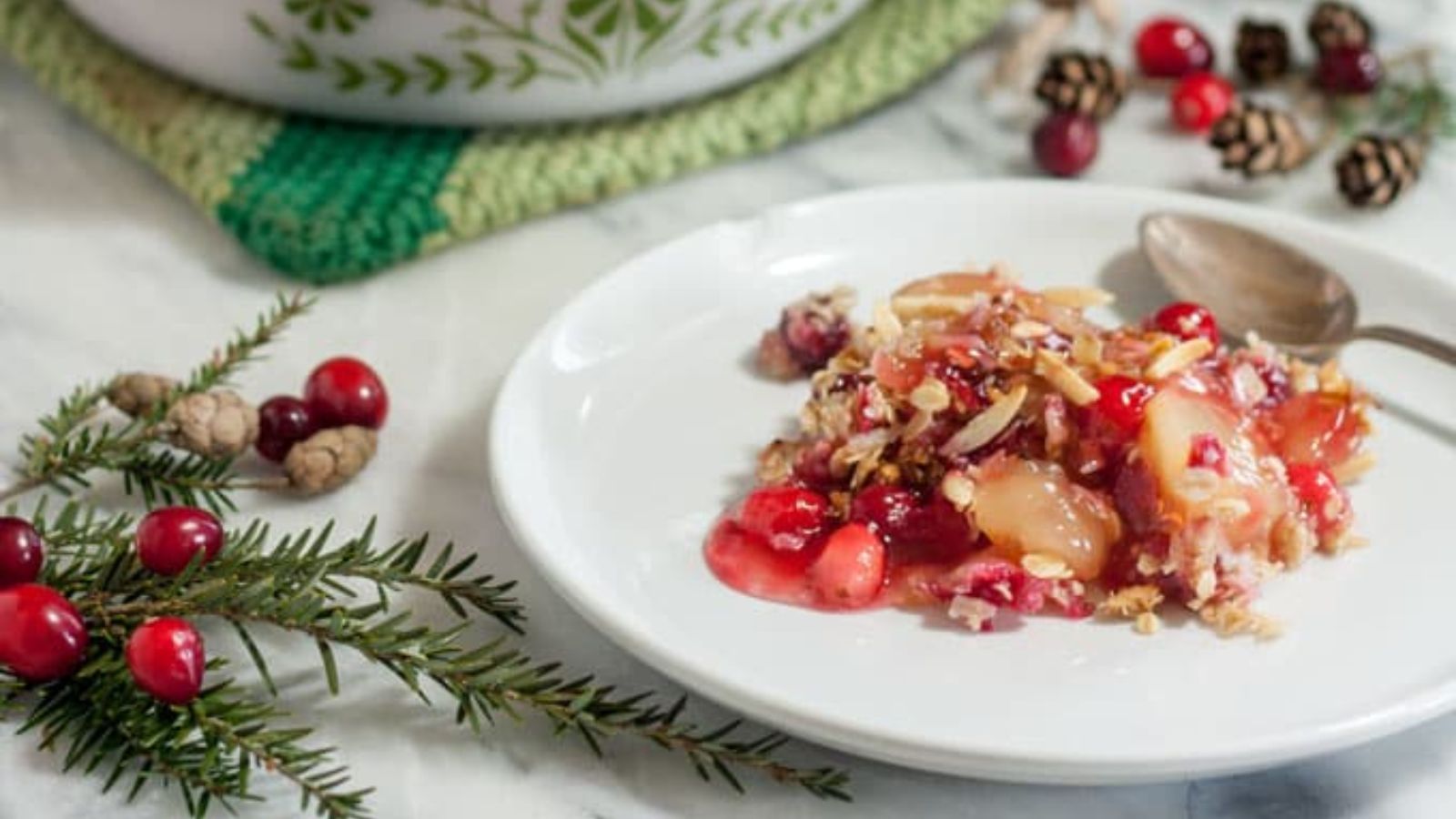 Apple cranberry crisp on a plate.