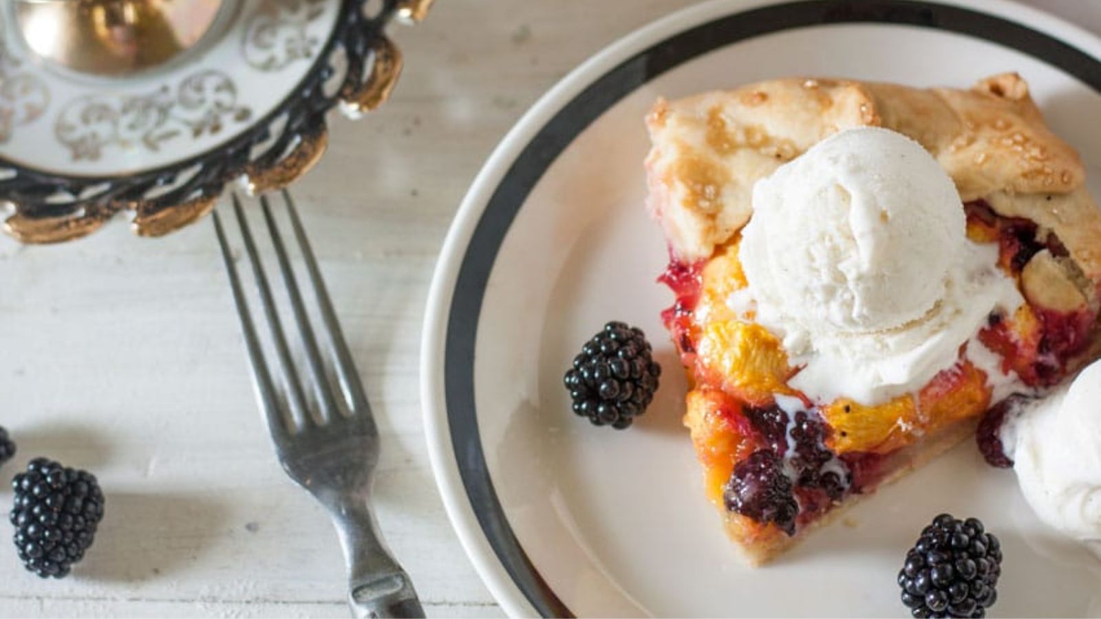 Blackberry peach galette on a plate.
