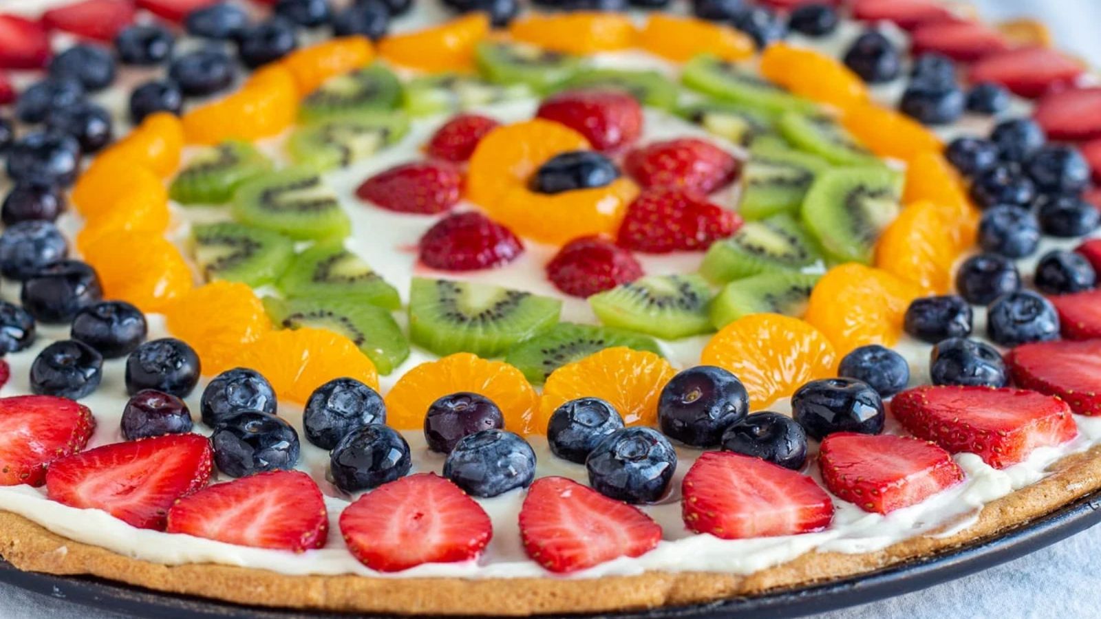 A whole fruit pizza.