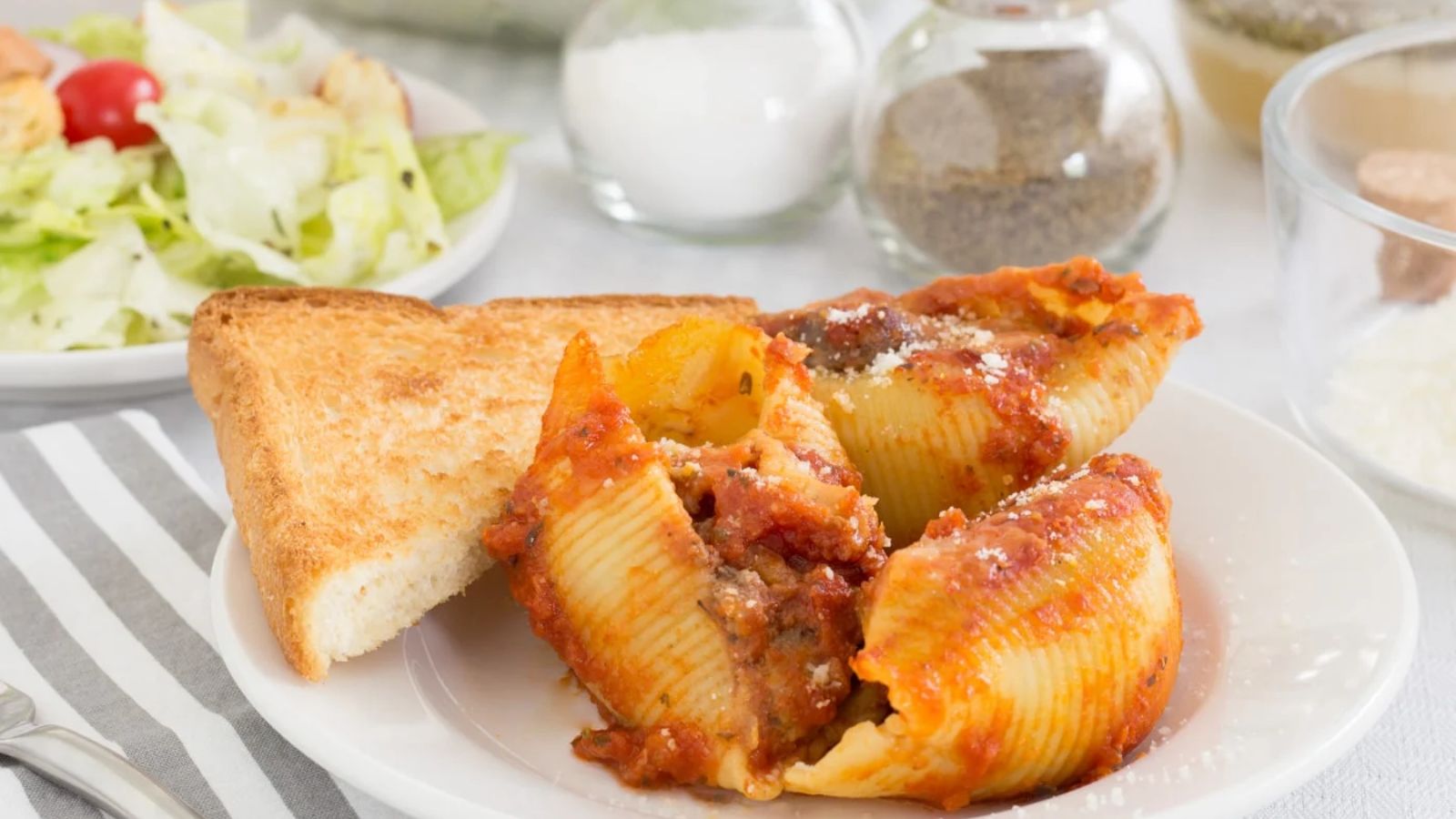 Meat stuffed shells on a plate.