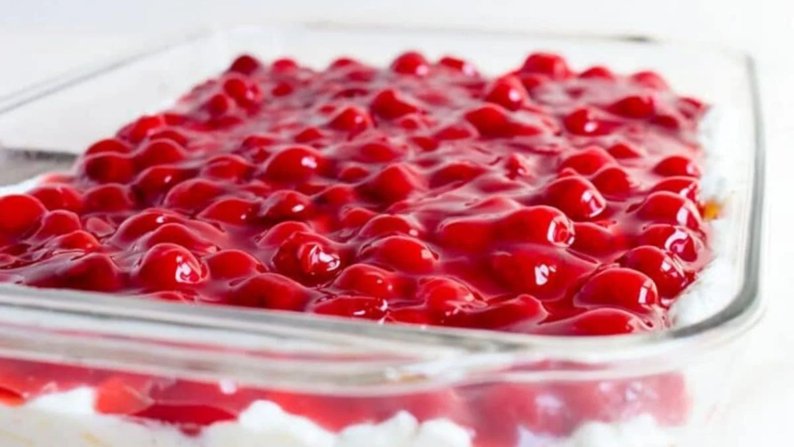 No bake cherry delight on a glass tray.