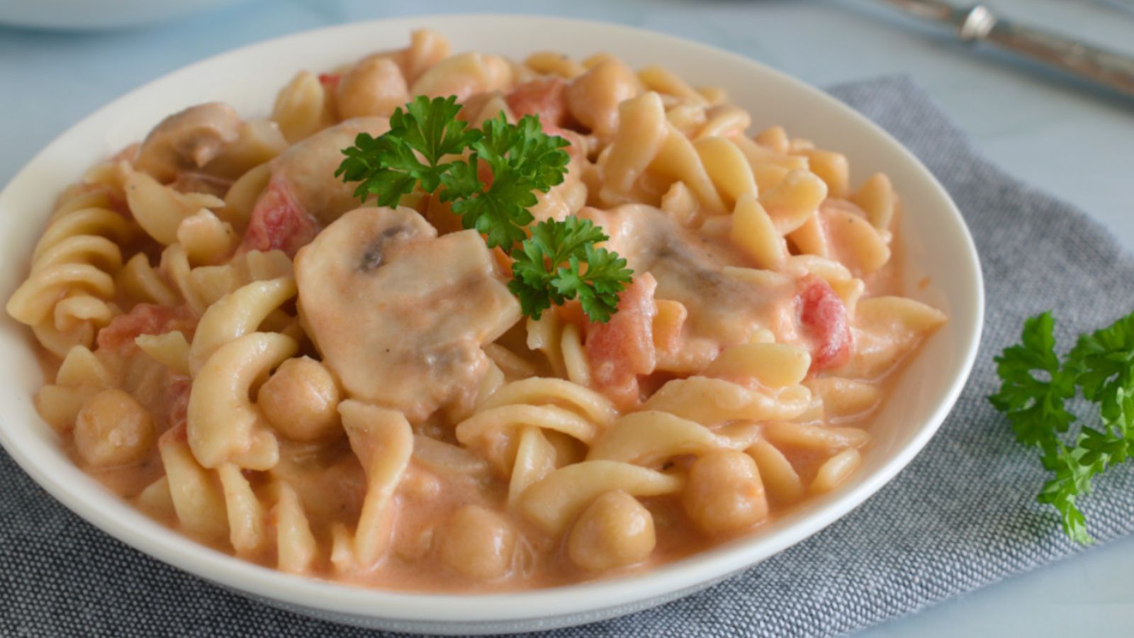 Pasta with coconut milk on a plate.