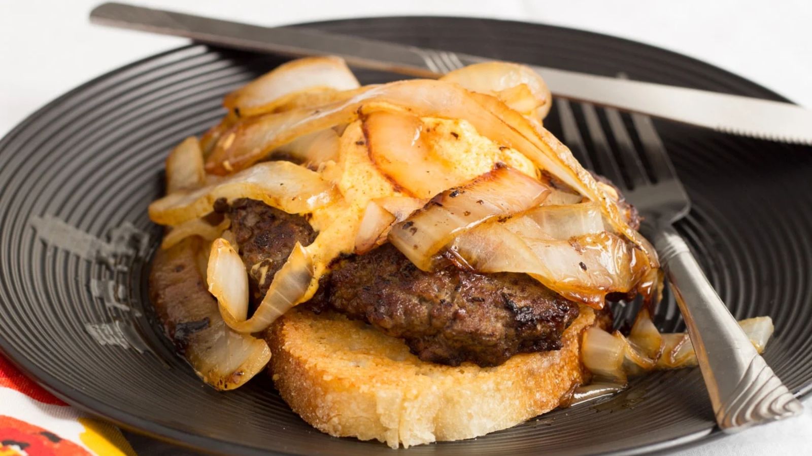 Pub cheese burger on a plate.