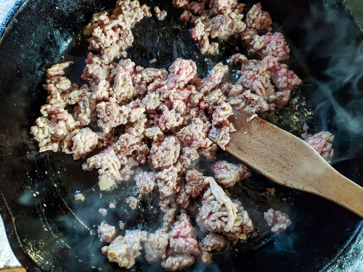 Brown meat in a skillet.
