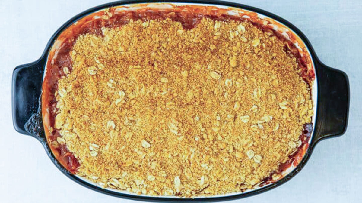 Baked gooseberry in an oval tray.