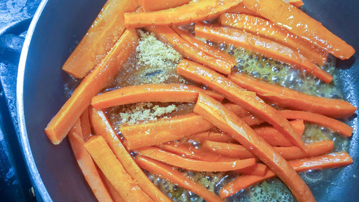 Browning the carrots in the skillet.