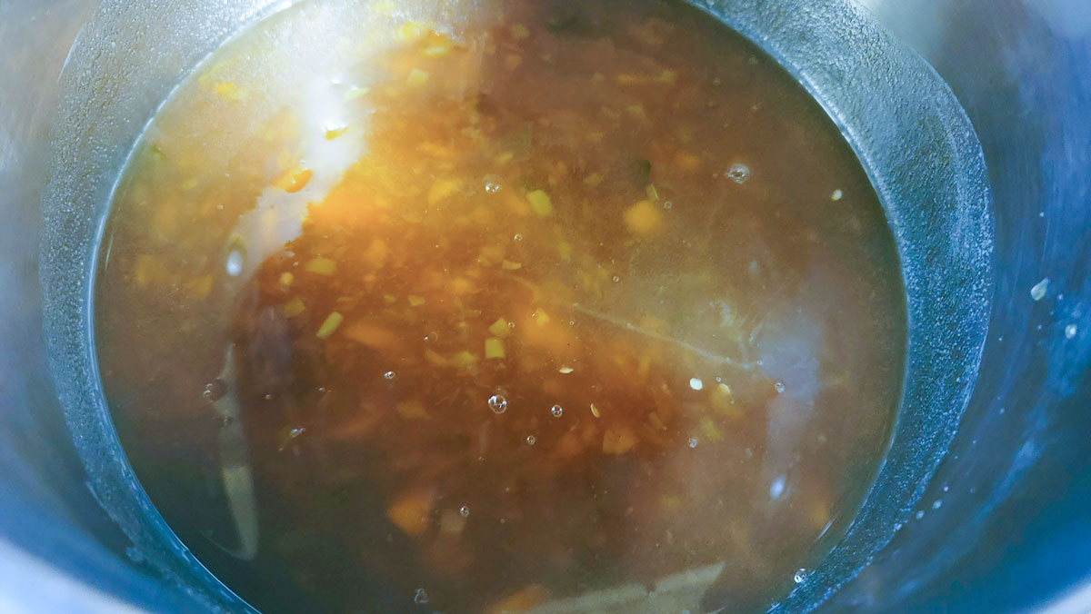 Runny jam added to the pot.