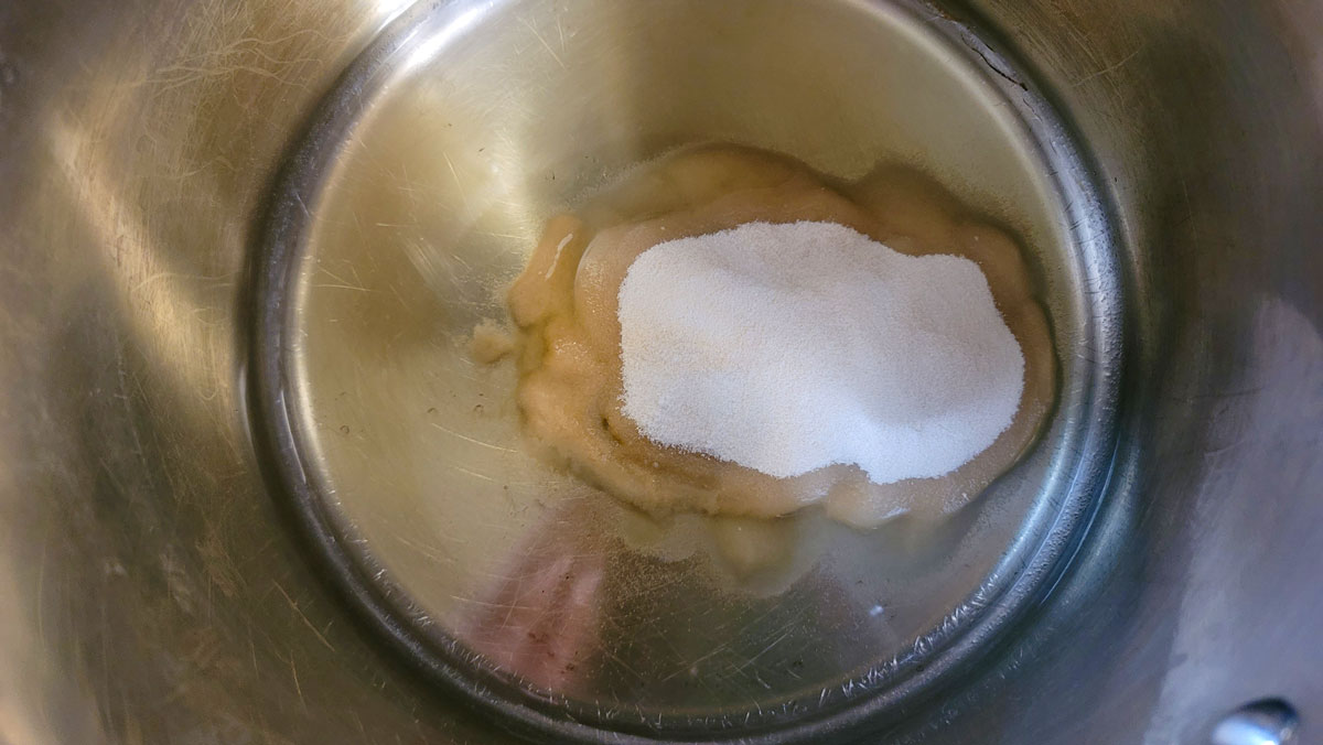 Sugar mixture added to water and acid in a medium saucepan.