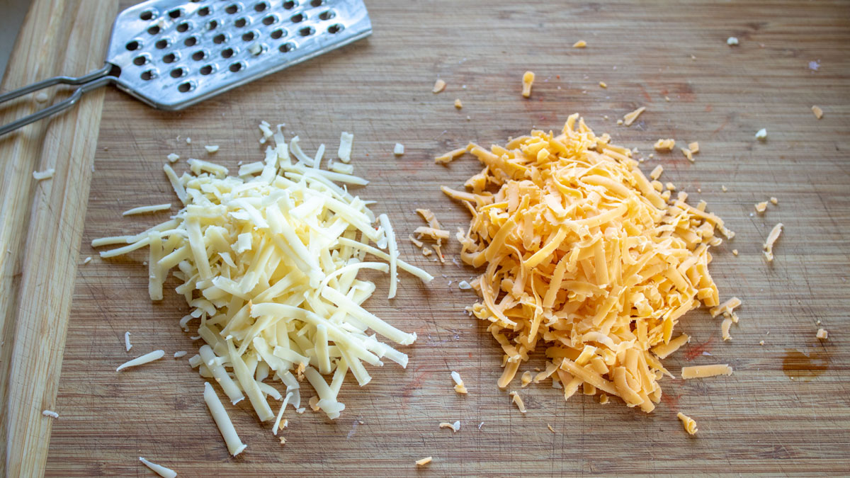 Grated cheese on a board.