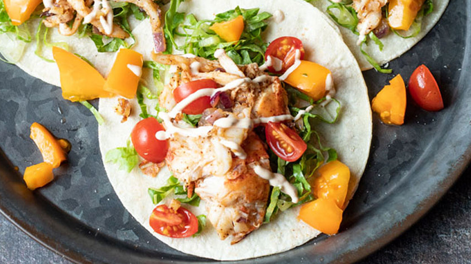 Close up of a taco loaded with lobster meat.