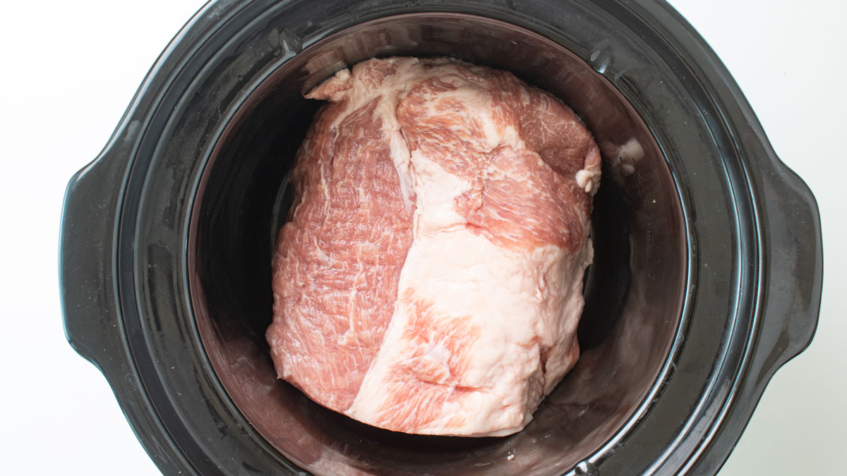 Pork roast placed in a crockpot.