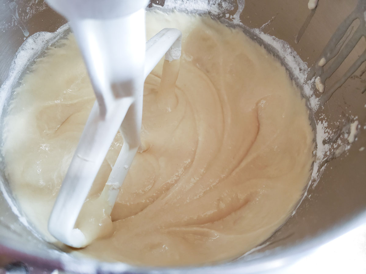 Dough starting to take shape in the mixing bowl.