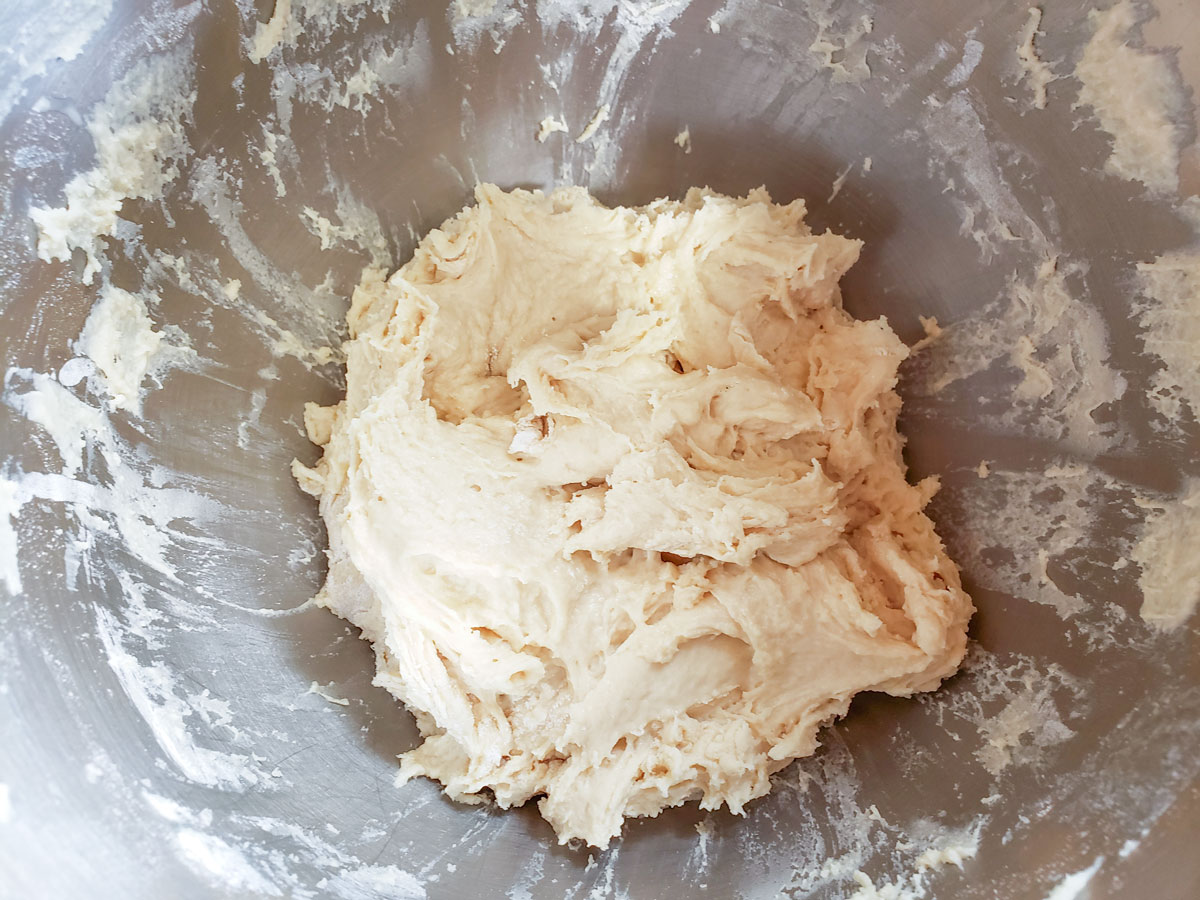 Dough clumped up in the middle of the bowl.