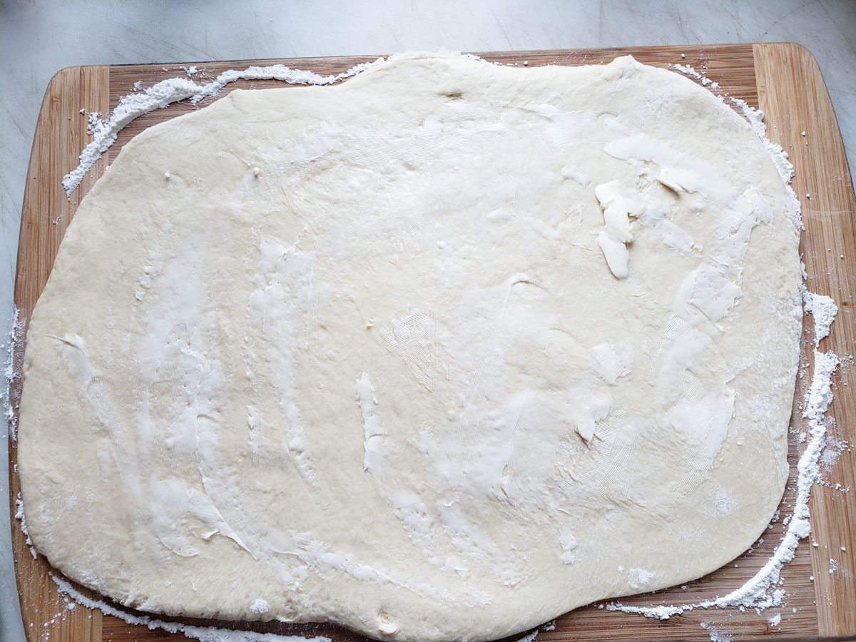 Dough rolled out into a large rectangle.