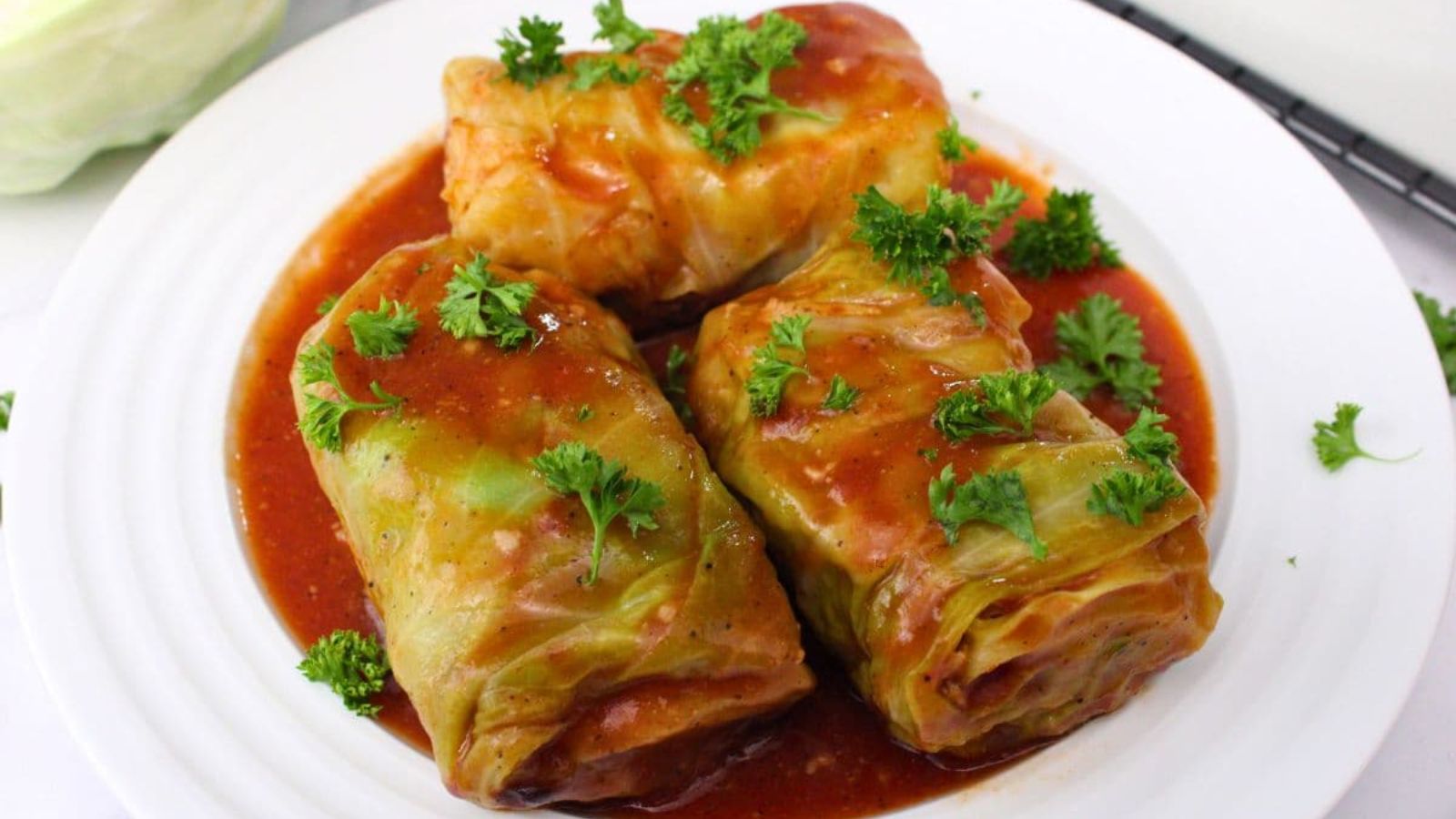 Cabbage rolls on a plate.