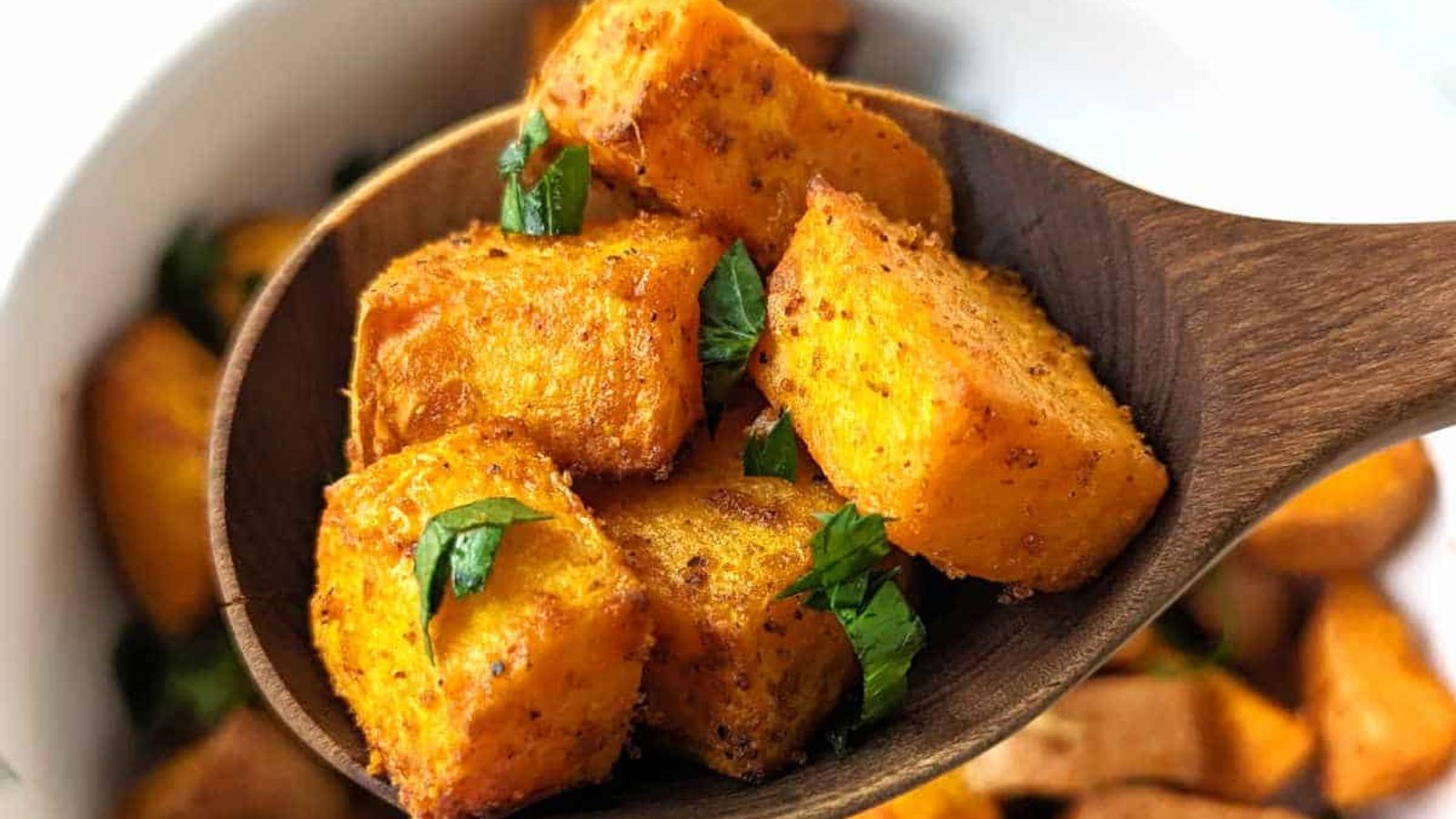 Sweet potato cubes on a spoon.