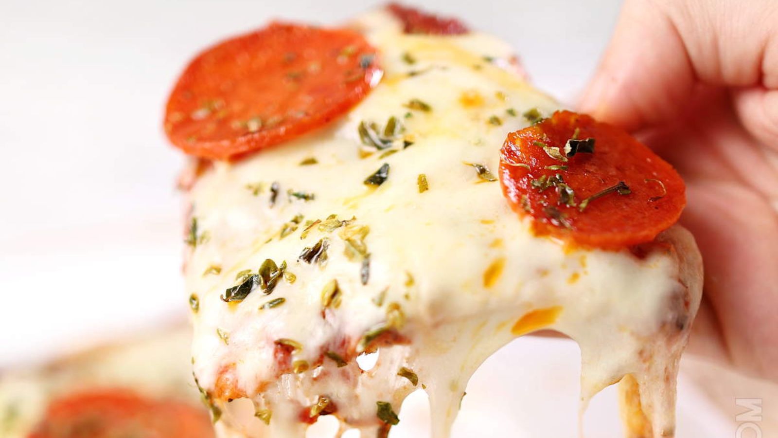 A slice of pizza with pepperoni. 