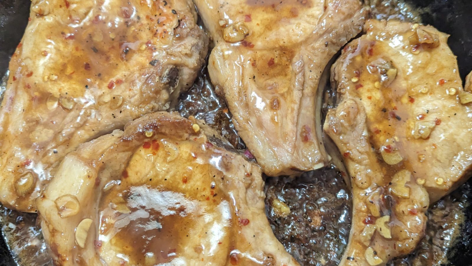 Marinated pork chops with sauce.